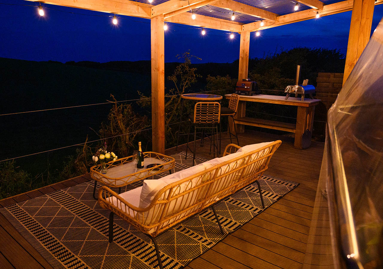 The outdoor terrace at Dalriada Den glamping dome at Coorie Retreats