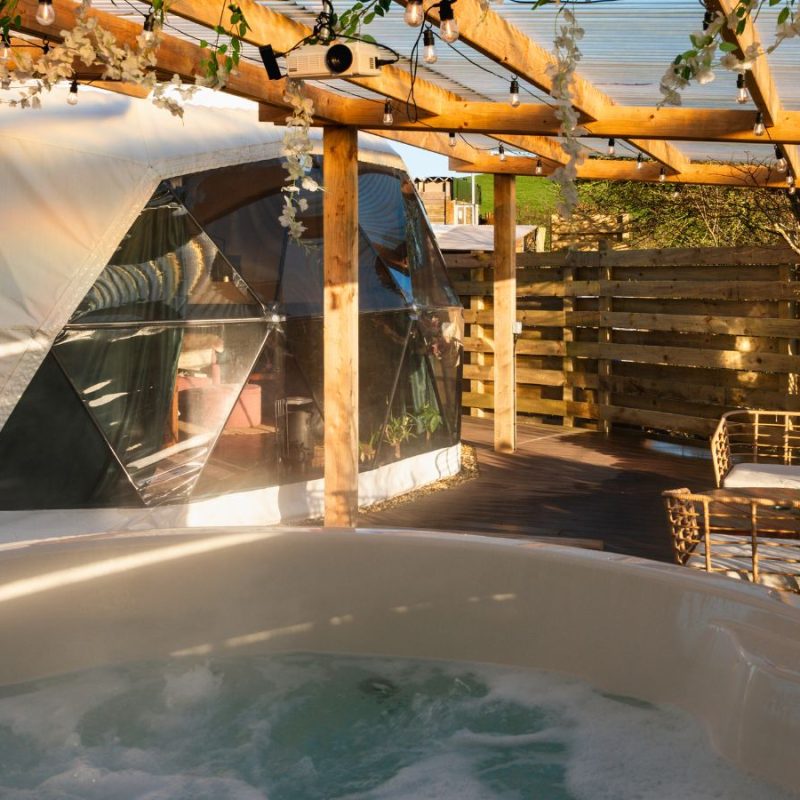 Outdoor tv and hot tub glamping pod at Coorie Retreats